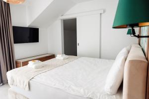เตียงในห้องที่ Park Residence 1