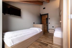 Ένα ή περισσότερα κρεβάτια σε δωμάτιο στο Chalet Pandora Bivio Travel
