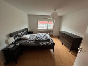 Ένα ή περισσότερα κρεβάτια σε δωμάτιο στο Ferienwohnung am Bodensee