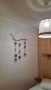 a room with a wall with pictures on the wall at L'esquirol ! in Les Angles