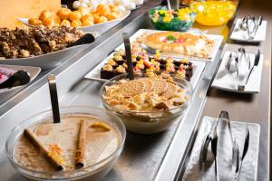 a buffet with many different types of desserts on a table at HOVIMA Santa Mar&iacute;a in Adeje