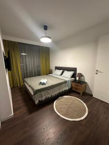 a bedroom with a bed and a rug on the floor at Grand Sapphire Resort Casino in Iskele