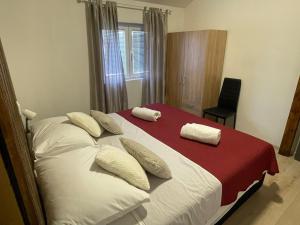 Postel nebo postele na pokoji v ubytování Apartman Leina