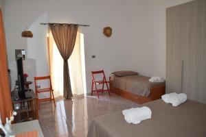 A bed or beds in a room at Casetta in Salento