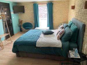 Letto o letti in una camera di Chambres d’hôtes de l’Ancienne Auberge