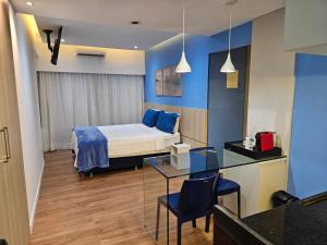 a room with a bed and a table in a room at Mercure Recife Navegantes - Privado in Recife +21 photos