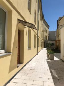 an empty alleyway in a building with a door at M&C Apartmans in Olomouc