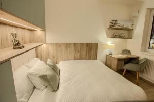 Ένα ή περισσότερα κρεβάτια σε δωμάτιο στο Chopok Apartments