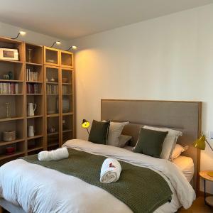 two beds sitting next to each other in a bedroom at Maï Homes - La Villa Bompard in Marseille