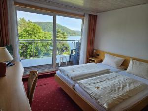Postel nebo postele na pokoji v ubytování Seehotel Andree & Gästehaus Seehof