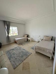 Postel nebo postele na pokoji v ubytování Seaside Luxury Apartment