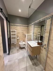 a bathroom with a toilet and a sink and a shower at Quai de la Loire in Blois +33 photos
