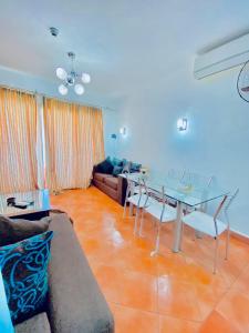 a living room with a glass table and a couch at porto elsokhna in Ain Sokhna