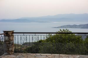 a view of the ocean from a balcony at Under Villa J in Katochori