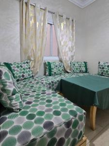 Postel nebo postele na pokoji v ubytování Appartement à louer wadie