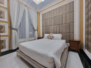 Postel nebo postele na pokoji v ubytování Villa Puncak Bogor New star