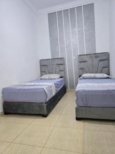 Postel nebo postele na pokoji v ubytování Appartement à louer wadie