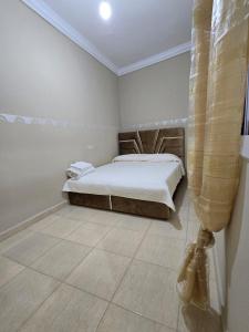 Postel nebo postele na pokoji v ubytování Appartement à louer wadie