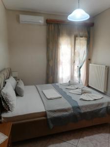 Postel nebo postele na pokoji v ubytování POPI 'S HOME