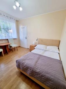 Postel nebo postele na pokoji v ubytování Pokoje Basia