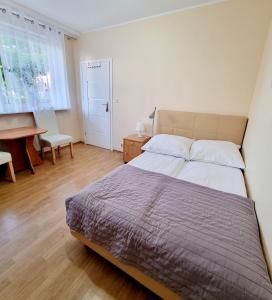 Postel nebo postele na pokoji v ubytování Pokoje Basia