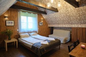 Postel nebo postele na pokoji v ubytování Villa Biesisko Przysłup Cisna + 37 fotografií