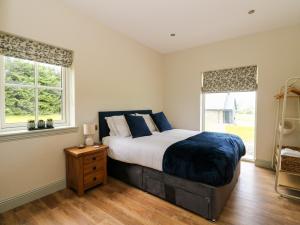 Un ou plusieurs lits dans un hébergement de l'établissement Bramble Cottage