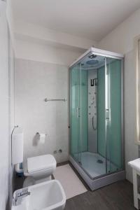 a bathroom with a glass shower and a toilet at Locanda Alla Posta in Cavaso del Tomba