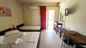 A bed or beds in a room at Studios Achileus 2