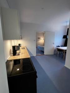 a kitchen with a stove and a counter top at Whaletours Apartments nr 2 in Ilulissat