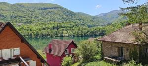 a view of a lake with mountains in the background at Apartman Plivsko Jezero Jajce in Jajce