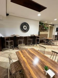 a large room with a large wooden table and chairs at Hotel Anunciada in Baiona