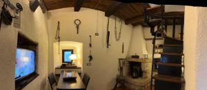 a room with swords hanging on the wall at Castello di Francocci Spoleto in Marzolini