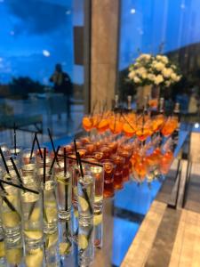 a bunch of glasses filled with drinks on a table at Kobuleti Family apartment in K'obulet'i