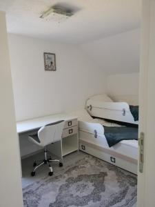 a bedroom with a desk and a bed and a chair at Villa Forest Sky, Sarajevo, Ilijaš in Ilijaš