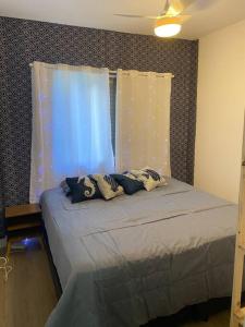 Кровать или кровати в номере Seu apartamento na Praia