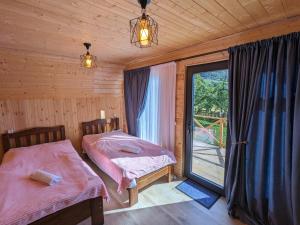 Krevet ili kreveti u jedinici u okviru objekta Guest House in Zhabeshi Lali