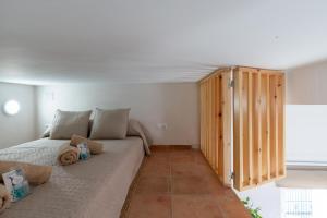 a bedroom with a large bed and a wooden closet at Apartamento Isaac Peral 3 in Chipiona