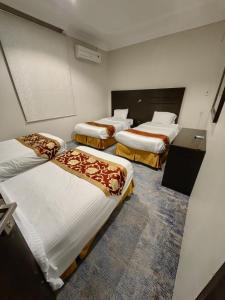 Postel nebo postele na pokoji v ubytování Elaf HotelSuits