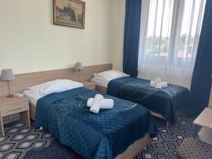 Posteľ alebo postele v izbe v ubytovaní Hotel Vistula