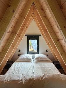 Postel nebo postele na pokoji v ubytování E d e l h e r t - Luxe Alpenhuis in prachtig Karinthië