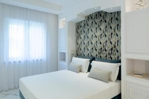 Postel nebo postele na pokoji v ubytování Maison Adriana