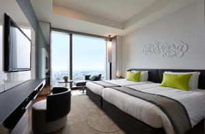 Postel nebo postele na pokoji v ubytování Futakotamagawa Excel Hotel Tokyu