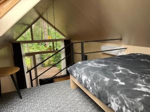 Postel nebo postele na pokoji v ubytování Sea dune cottage Kalnu