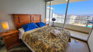 En eller flere senge i et værelse på Resort Urbano Laguna del Mar + 26 billeder