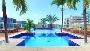 Bazén v ubytování Edifício JTR Apartamentos Beira Mar- Hosti nebo v jeho okolí