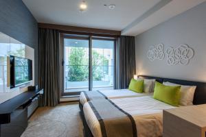 Postel nebo postele na pokoji v ubytování Futakotamagawa Excel Hotel Tokyu