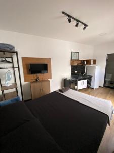 Ένα ή περισσότερα κρεβάτια σε δωμάτιο στο Loft Santos dumont