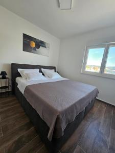 Ένα ή περισσότερα κρεβάτια σε δωμάτιο στο Wanderlust Apartment