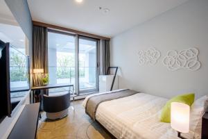 Postel nebo postele na pokoji v ubytování Futakotamagawa Excel Hotel Tokyu